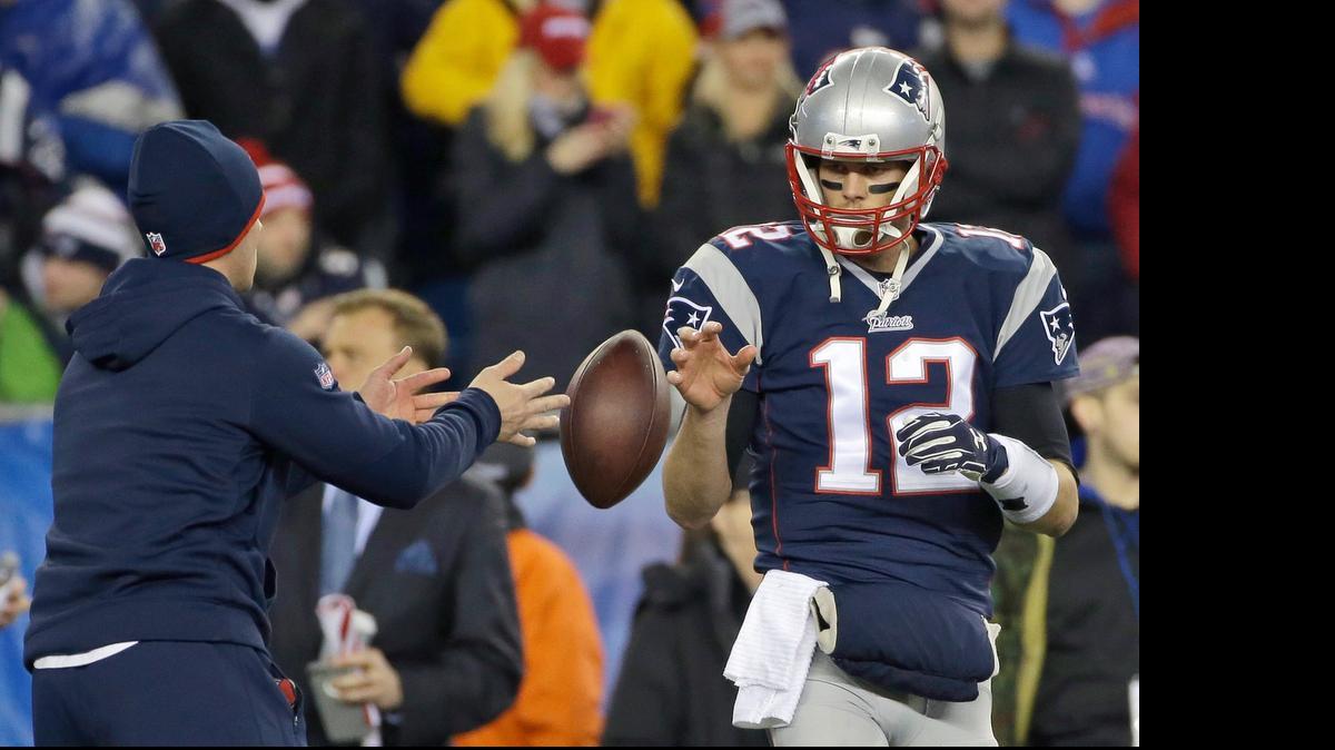 
In this Jan. 18, 2015, file photo, New England Patriots quarterback Tom Brady has a ball tossed to him during warmups before the NFL football AFC Championship game against the Indianapolis Colts in Foxborough, Mass. Brady's four-game suspension for his role in using underinflated footballs during the AFC championship game last season has been upheld by NFL Commissioner Roger Goodell. The league announced the decision Tuesday, July 28, 2015. 
