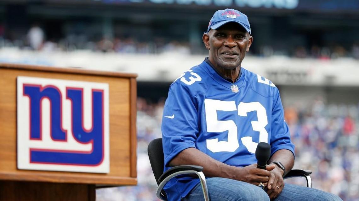 Former New York Giants player Harry Carson listens during a halftime ceremony of an NFL football game between the New York Giants and the New Orleans Saints Sunday, Sept. 18, 2016, in East Rutherford, N.J.