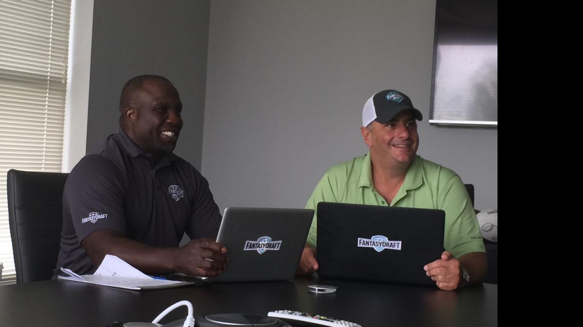 
Former NFL player London Fletcher, left, and FantasyDraft CEO Grant Yoder
