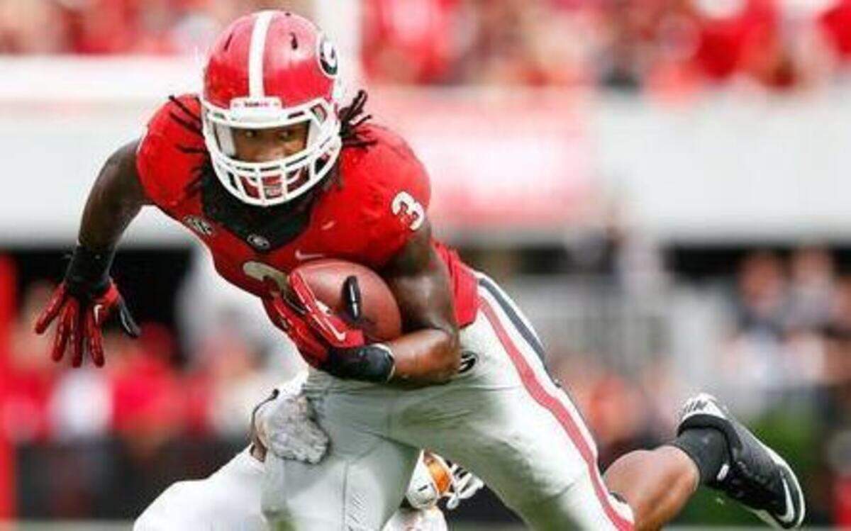 
Georgia running back Todd Gurley breaks a tackle against Tennessee at Sanford Stadium on Sept. 27, 2014 in Athens, Ga. 
