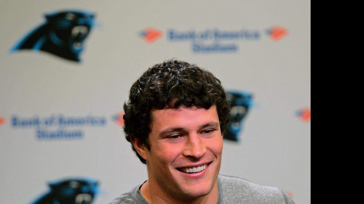 
Carolina Panthers linebacker Luke Kuechly smiles as he responds to a reporter's question on Monday, April 20, 2015. The Panthers held a new conference in conjunction with the beginning of their off-season workout program. Monday was Kuechly's 24th birthday.
