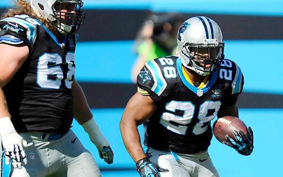 
Carolina Panthers' Jonathan Stewart (28) heads upfield as Andrew Norwell (68) looks to block against the Seattle Seahawks during the first half at Bank of America Stadium on Sunday, October 26, 2014. The Seahawks won 13-9.
