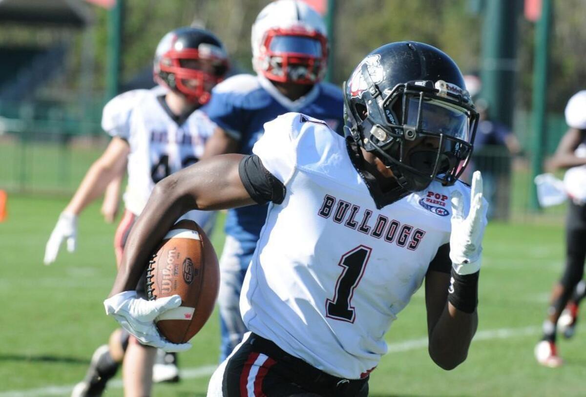 North Raleigh Bulldogs player Noah Rogers runs with the ball in the Pop Warner semifinal game against the Dorchester Eagles at ESPN Wide World of Sports in Orlando, Fla. Wednesday, Dec. 06, 2017.
