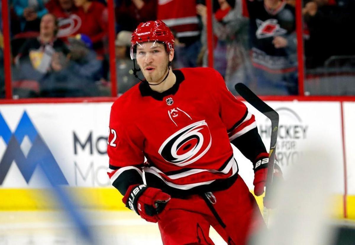 The Canes' Brett Pesce (22) celebrates after he scored during the first period of an NHL game played between the Carolina Hurricanes and the Vancouver Canucks at PNC Arena in Raleigh on Friday, Feb. 9, 2018.