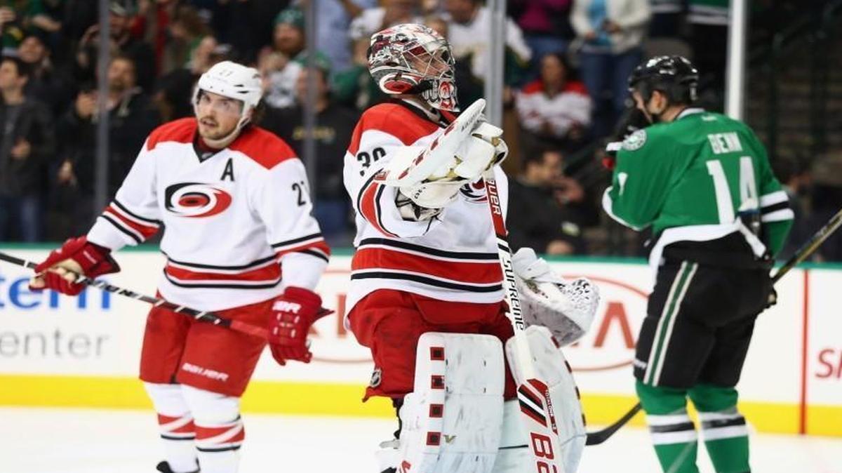 Hurricanes goalie Cam Ward reacts after giving up the fourth goal against the Dallas Stars in the first period at American Airlines Center in Dallas, Texas.