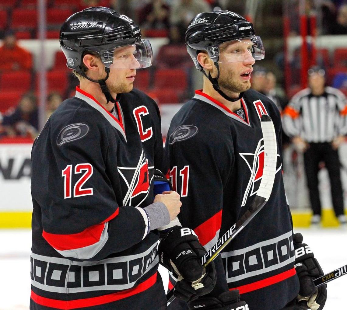 “Sometimes I’d look up and I’d see my younger brother waiting for a pass and in that brief second, I’d just have to pinch myself,” Eric Staal wrote in The Players’ Tribune, a personal thank-you note to the Carolina Hurricanes organization and Hurricanes fans. Here, Eric Staal (12) confers with his brother Jordan Staal (11) during a game with the New York Islanders at PNC Arena in Raleigh on Feb. 17, 2015.