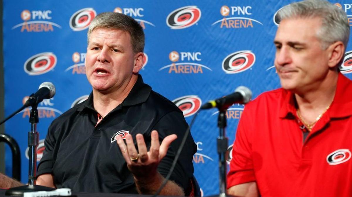 The Carolina Hurricanes' head coach Bill Peters, left, and general manager Ron Francis at press conference at PNC Arena on April 12, 2017.