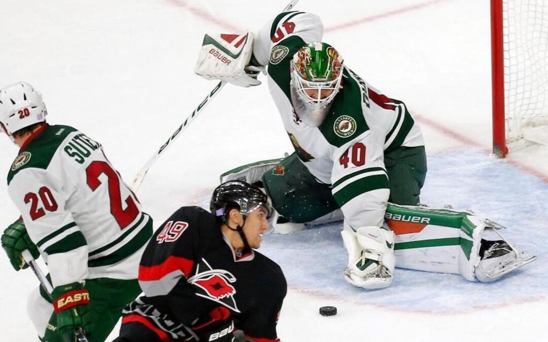 The Canes’ Victor Rask (49) is defended by the Wild's Ryan Suter (20) and goalie Devan Dubnyk (40) during the third period at PNC Arena in Raleigh.