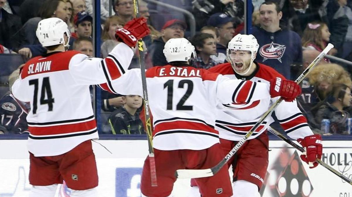 Carolina Hurricanes' Jordan Staal, right, celebrates his game-winning goal against the Columbus Blue Jackets in Columbus, Ohio.