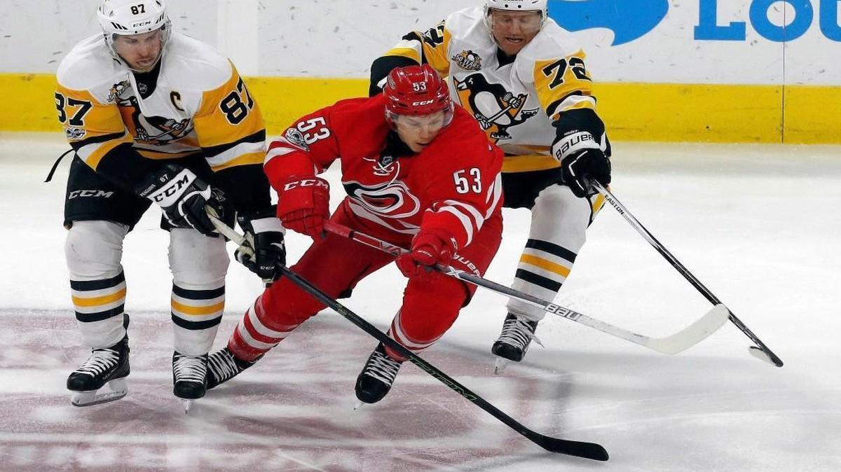 The Pittsburgh Penguins' Sidney Crosby (87) and Patric Hornqvist (72) battle the Canes' Jeff Skinner (53) for the puck during game played between the Carolina Hurricanes and the Pittsburgh Penguins at PNC Arena on Feb. 21, 2017. The Pens beat the Canes 3-1.