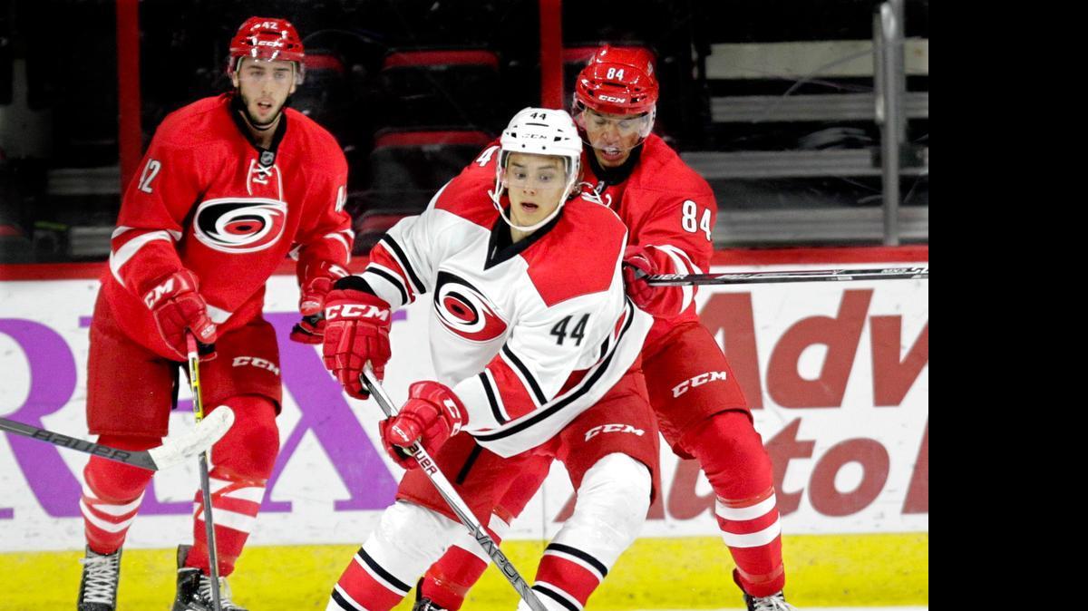 
Clark Bishop (42), Sebastian Aho (440 and Trevor Owens (84) play the puck as the Carolina Hurricanes hold a training camp for NHL prospects at PNC Arena in Raleigh on July 7, 2015.
