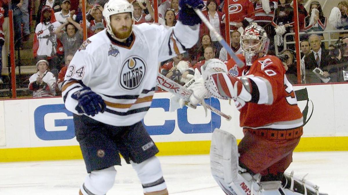 Edmonton’s Fernando Pisani (34) celebrates after he fired the game winning shot past the Canes Cam Ward (30) in overtime of Game 5 of the Stanley Cup Finals played between the Carolina Hurricanes and the Edmonton Oilers at the RBC Center. 6/14/06. The Canes lost 4-3 in overtime, making the series 3-2 in favor of the Canes.