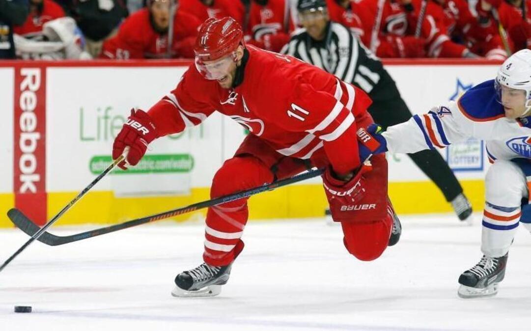 The Canes’ Jordan Staal, left, skates past the Edmonton’s Taylor Hall during the first period of their game Wednesday at PNC Arena in Raleigh. The game was not over in time for this edition. Get the latest news, stats and scores this season at nando.com/canes.