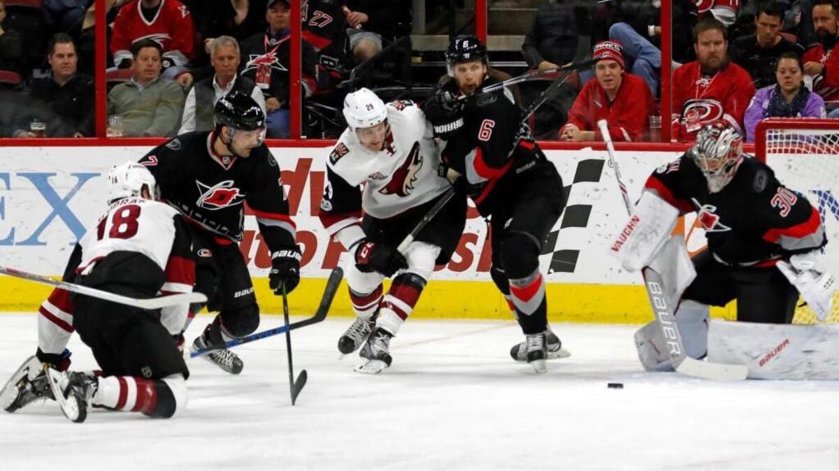 The Canes’ Ryan Murphy (7), Klas Dahlbeck (6) and Cam Ward (30) defend against the Arizona Coyotes' Christian Dvorak (18) and Brendan Perlini (29) at PNC Arena on March 3, 2017. The Coyotes beat the Canes 4-2.