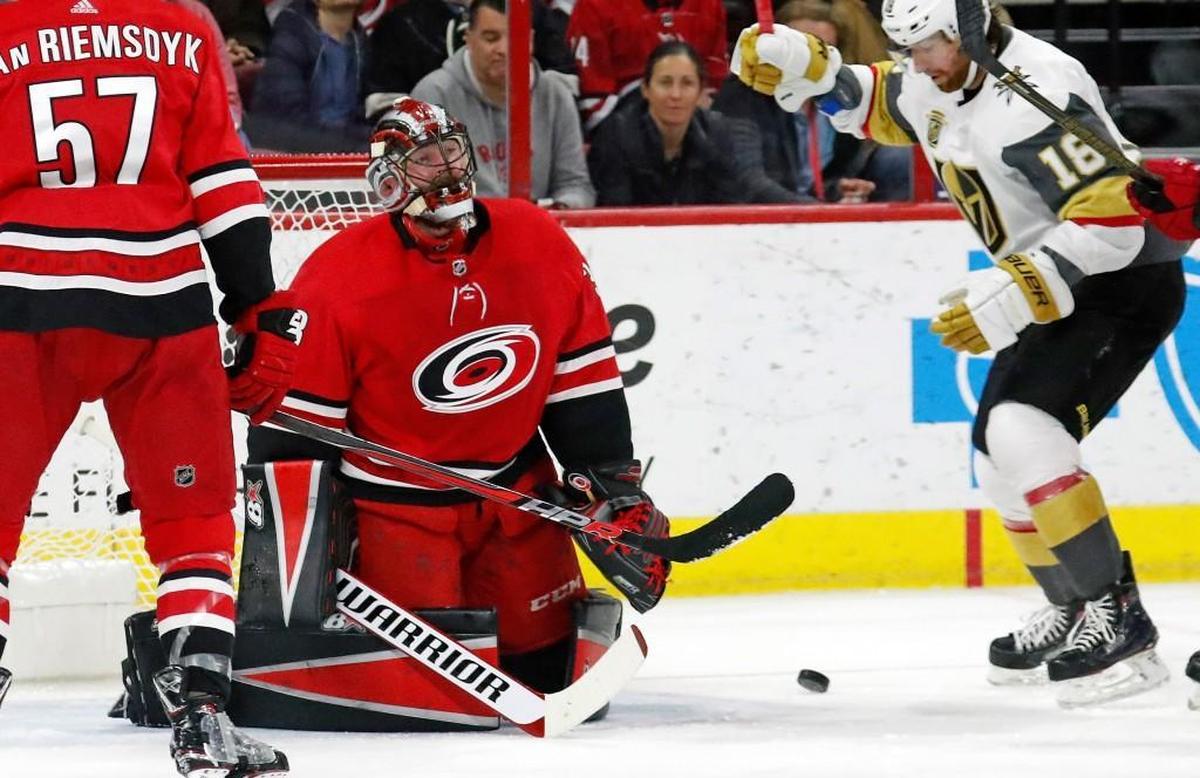 The Canes' Scott Darling (33) reacts after giving up the second goal during the first period of an NHL game played between the Carolina Hurricanes and the Las Vegas Golden Knights at PNC Arena in Raleigh, N.C. on Jan. 21, 2018. Trevor van Riemsdyk (57) and James Neal (18) are in on the play. The Knights beat the Canes 5-1.