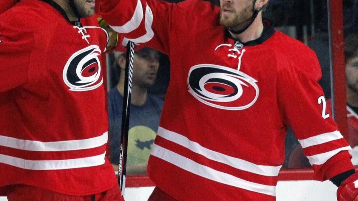 The Canes Bryan Bickell, right, congratulates teammate Viktor Stalberg on goal agianst the Philadelphia Flyers at PNC Arena on Oct. 30, 2016. Bickell has been diagnosed with multiple sclerosis (MS).