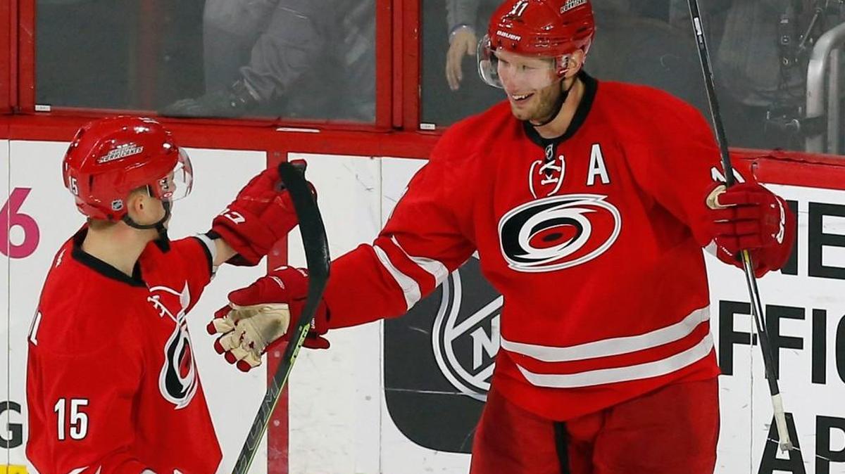 The Carolina Hurricanes' Jordan Staal (11) celebrates his empty-netter with Andrej Nestrasil (15) during the third period of an NHL game played between the Carolina Hurricanes and the San Jose Sharks at PNC Arena in Raleigh, N.C. on Feb. 19.