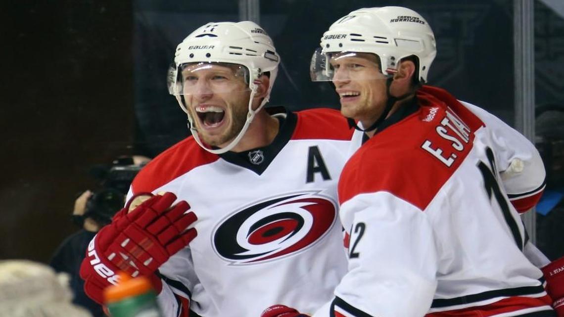 Carolina Hurricanes Jordan Staal (11) and Eric Staal (12) of the Carolina Hurricanes celebrate the game-tying goal by Chris Terry at 14:56 of the third period against the New York Islanders at the Barclays Center.