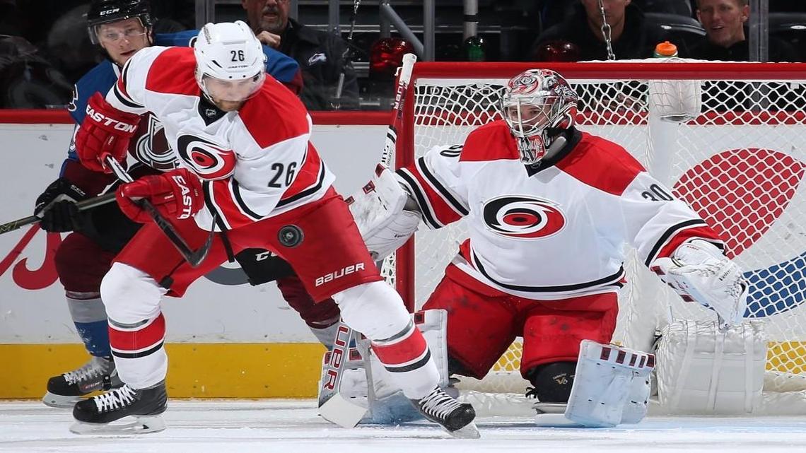 Carolina Hurricane John-Michael Liles (26) has made good use of his iPad and FaceTime on the Canes’ extended roadtrip. Goalie Cam Ward’s wife and two kids attended this game in Denver, where Ward shut out the Avalanche 1-0.