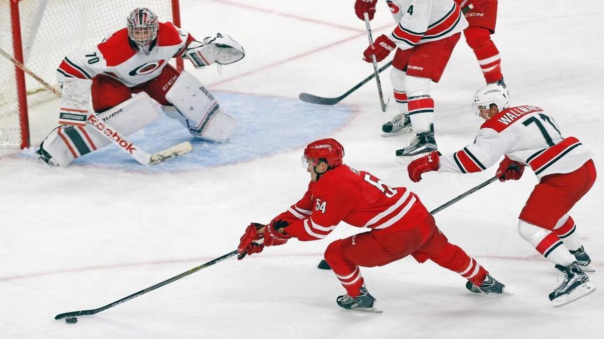 
The Red team's Brett Pesce (54) tries to score against the White team's Callum Booth (70) and Lucas Wallmark (71) during the Carolina Hurricanes intra-squad scrimmage at PNC Arena in Raleigh, N.C. on Sept. 20, 2015.
