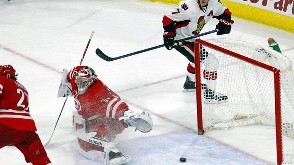 
Kyle Turris watches as the puck gets past Canes goalie Anton Khudobin on a shot by Mark Stone with less than 14 seconds left in overtime. Ottawa was 0-11-1 in its past 12 games at PNC Arena going into Tuesday’s game.
