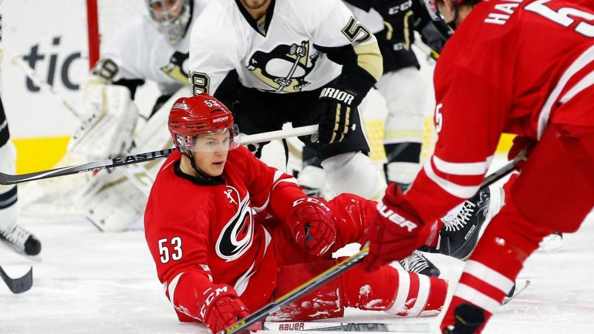 Carolina’s Jeff Skinner (53) and Noah Hanifin, right, work against the Penguins' Kris Letang (58) during the second period of the Hurricanes’ 2-1 preseason win.