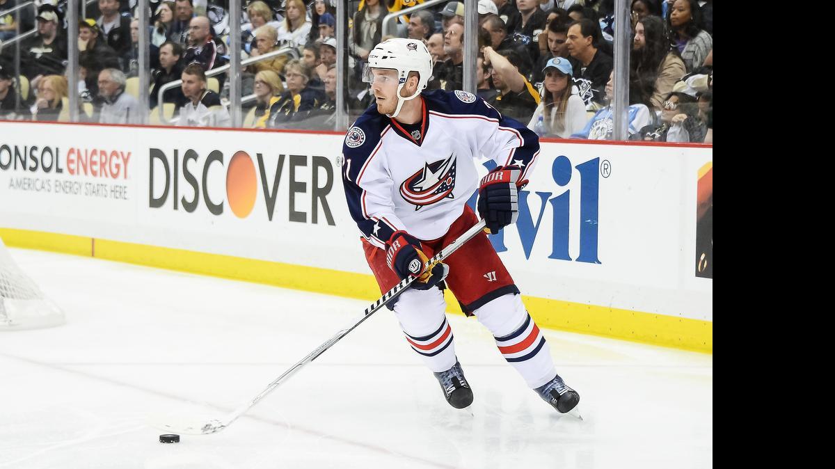 
James Wisniewski of the Columbus Blue Jackets skates with the puck against the Pittsburgh Penguins in 2014.
