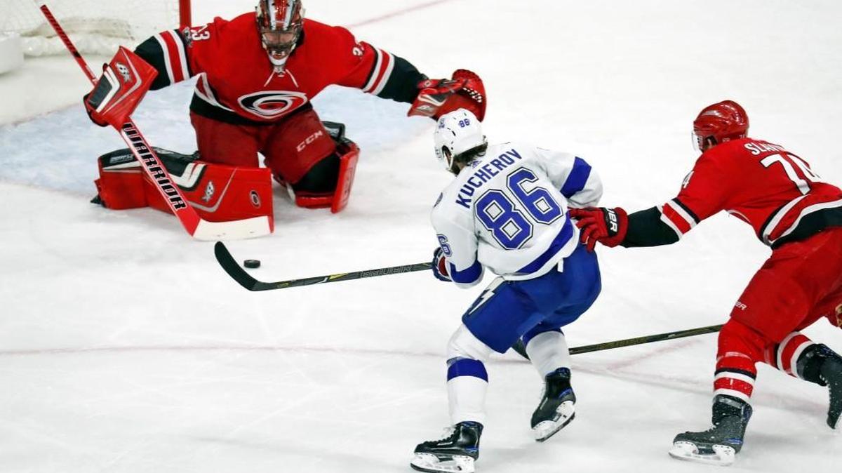 The Canes' Scott Darling (33) and Jaccob Slavin (74) defend the Lightning's Nikita Kucherov (86) during the third period of an NHL game played between the Carolina Hurricanes and the Tampa Bay Lightning at PNC Arena on Oct. 24, 2017. The Lightning beat the Canes 5-1.
