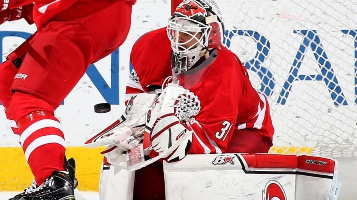 Eddie Lack goes down in the crease to make a glove save during the Hurricanes’ game against the Nashville Predators on March 18.