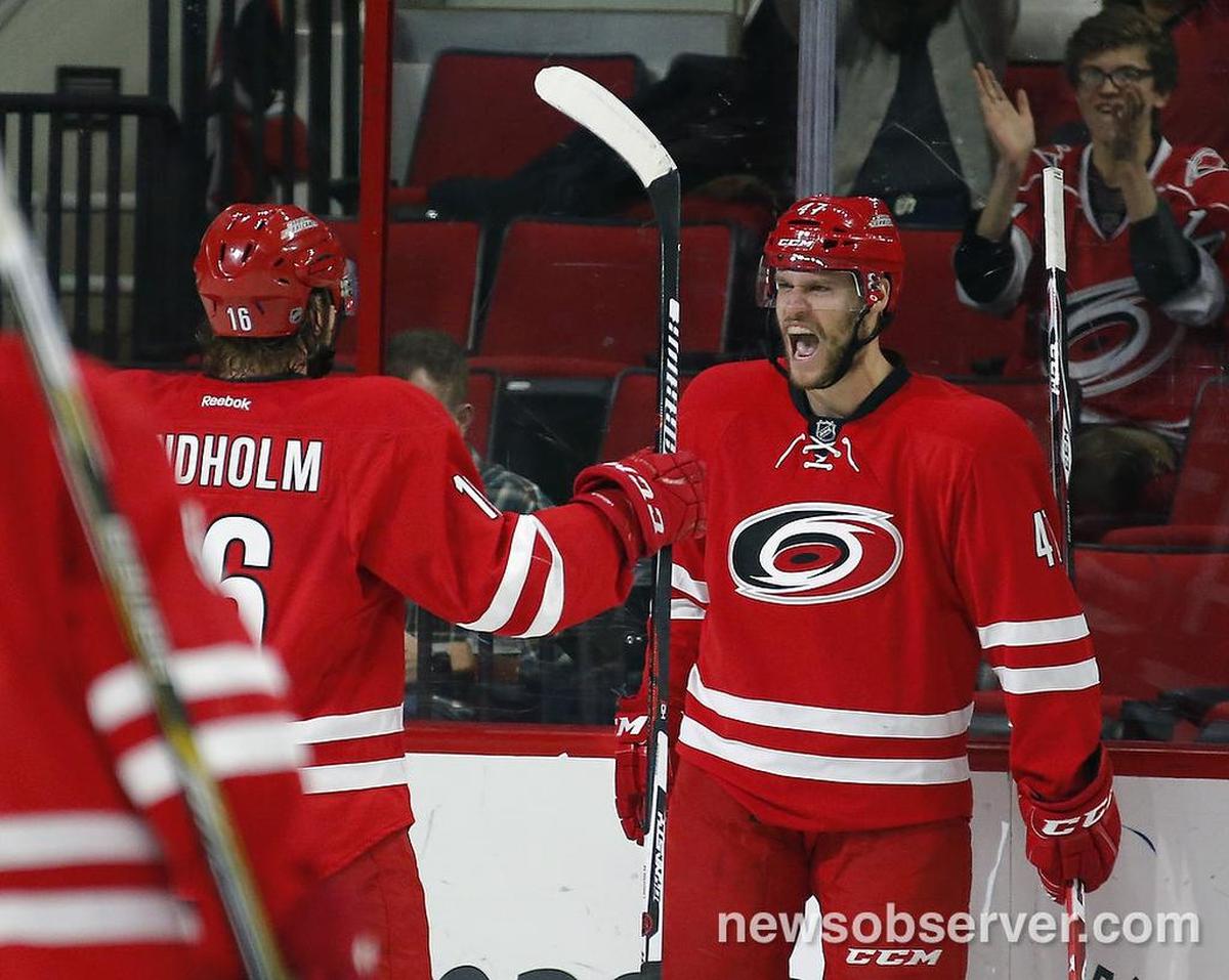 The Carolina Hurricanes’ Michal Jordan (47) celebrates his goal with Elias Lindholm (16) during the second period.