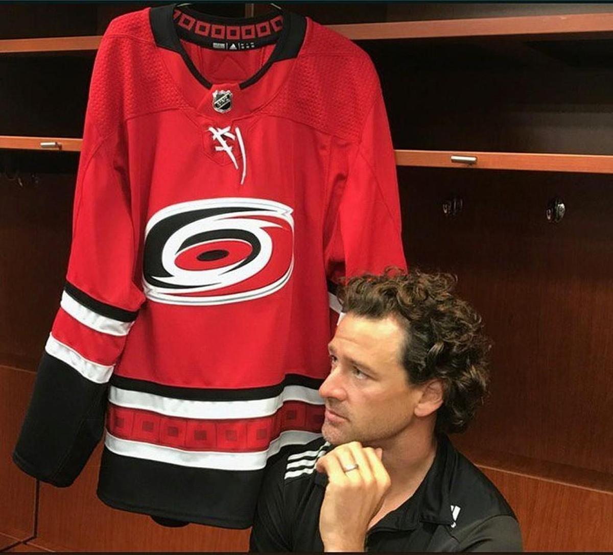 The Carolina Hurricanes' Justin Williams talks to the media at PNC Arena earlier this summer after he was signed as a free agent. Williams played on the Canes' 2006 Stanley Cup team and could be a candidate to be team captain.