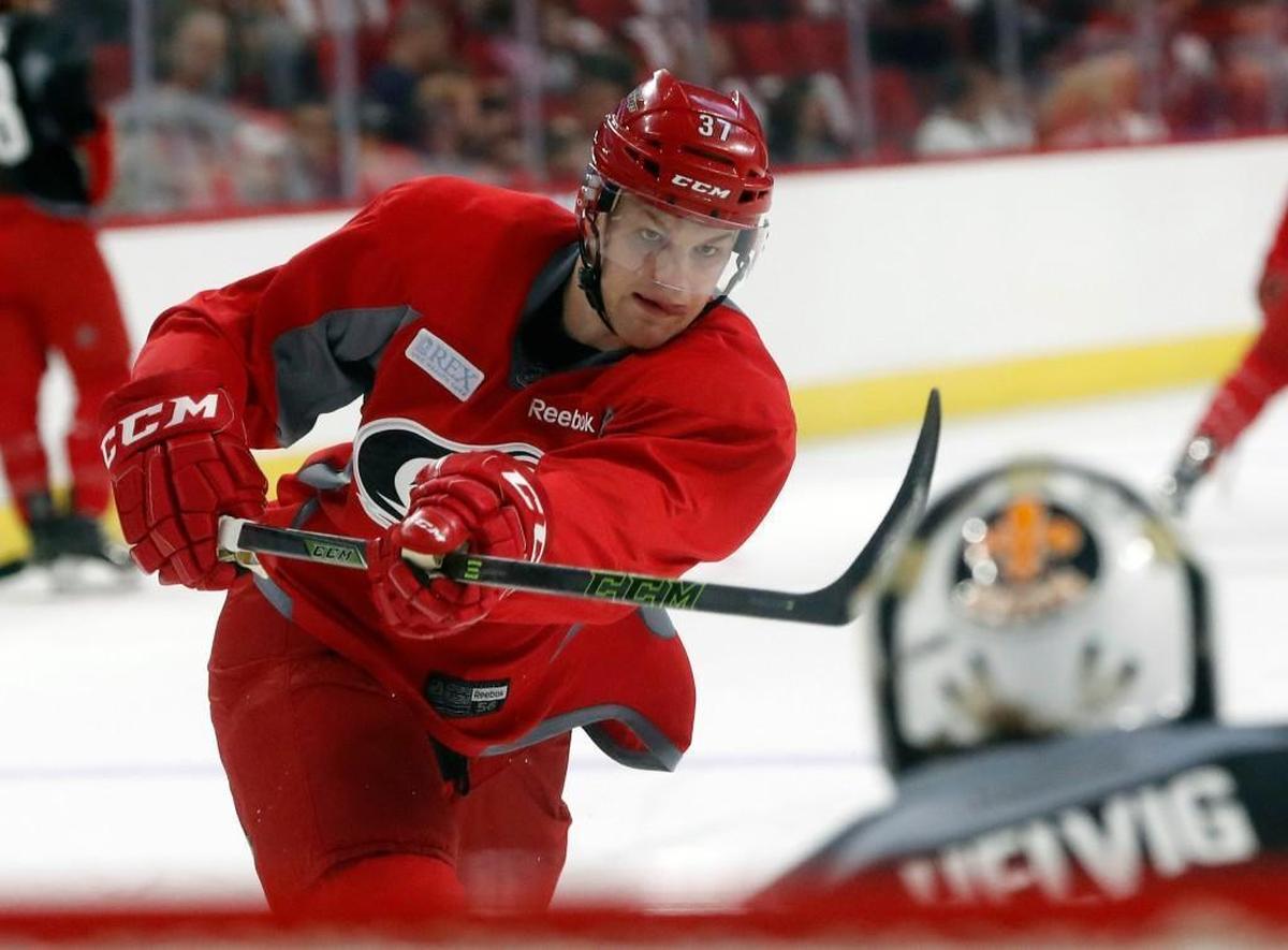 Warren Foegele (37) shoots against Jeremy Helvig (50) as the Carolina Hurricanes hold prospect camp for young hopefuls at PNC Arena on June 29, 2017.