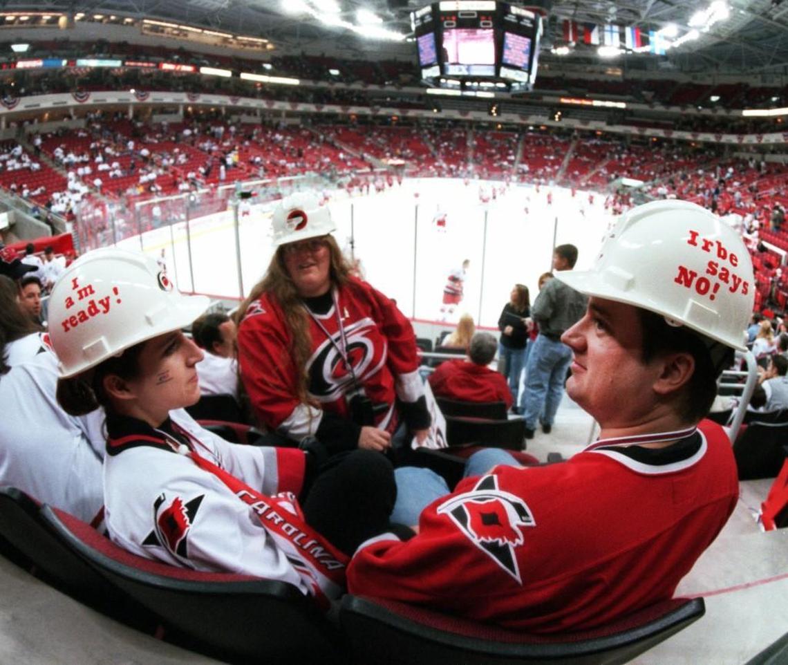 Hurricanes fans, from left, Karla Schriner, Sharon Shoemaker and John Schriner prepare for the Canes first game at the new Entertainment and Sports Arena on Oct. 29, 1999 in Raleigh.