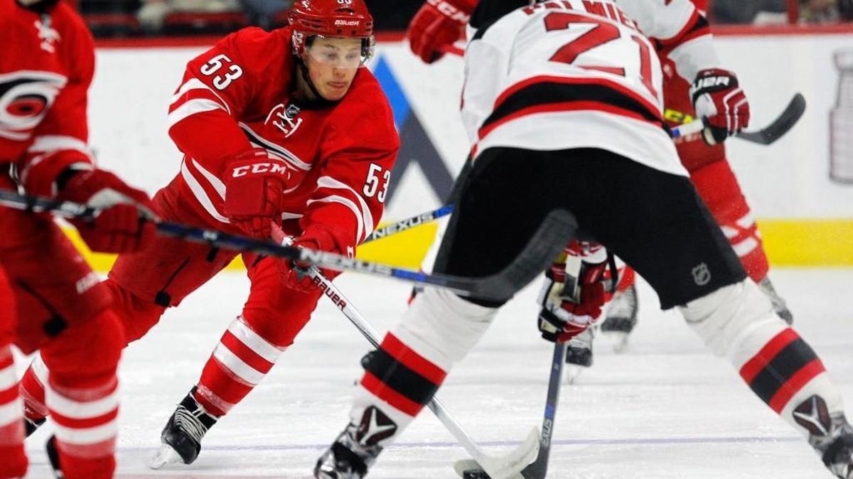 The Carolina Hurricanes' Jeff Skinner (53) moves against the New Jersey Devils' Kyle Palmieri (21) at PNC Arena in March.