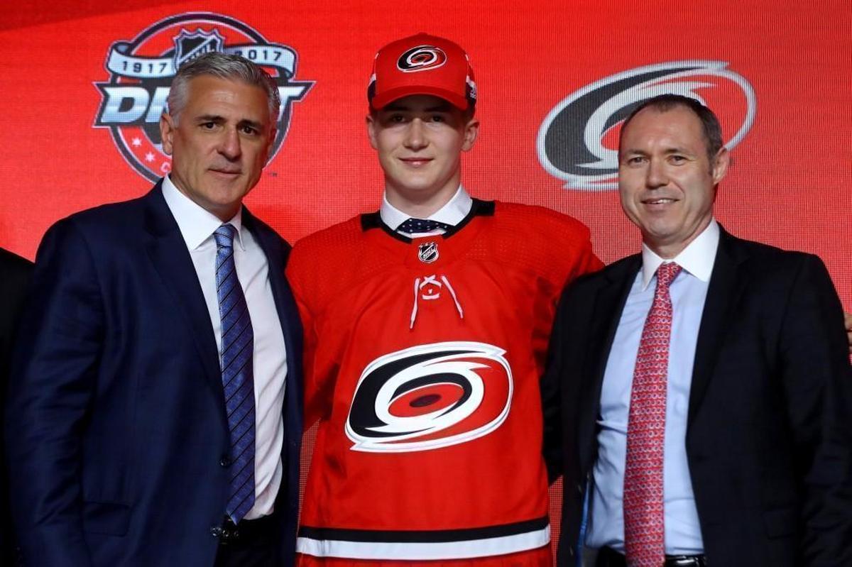 Martin Necas poses for photos with GM Ron Francis, left, and after being selected 12th overall by the Carolina Hurricanes during the 2017 NHL Draft at the United Center in Chicago.