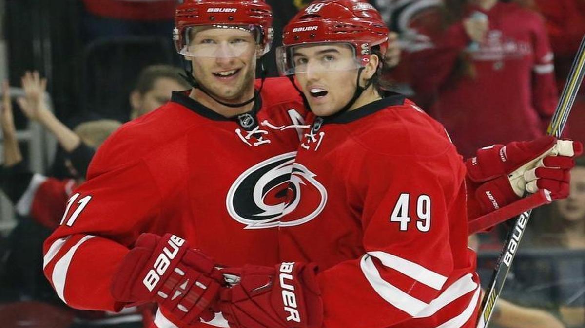 The Carolina Hurricanes' Victor Rask (49) celebrates his goal with Jordan Staal (11) during the first period against the New Jersey Devils at PNC Arena in Raleigh.
