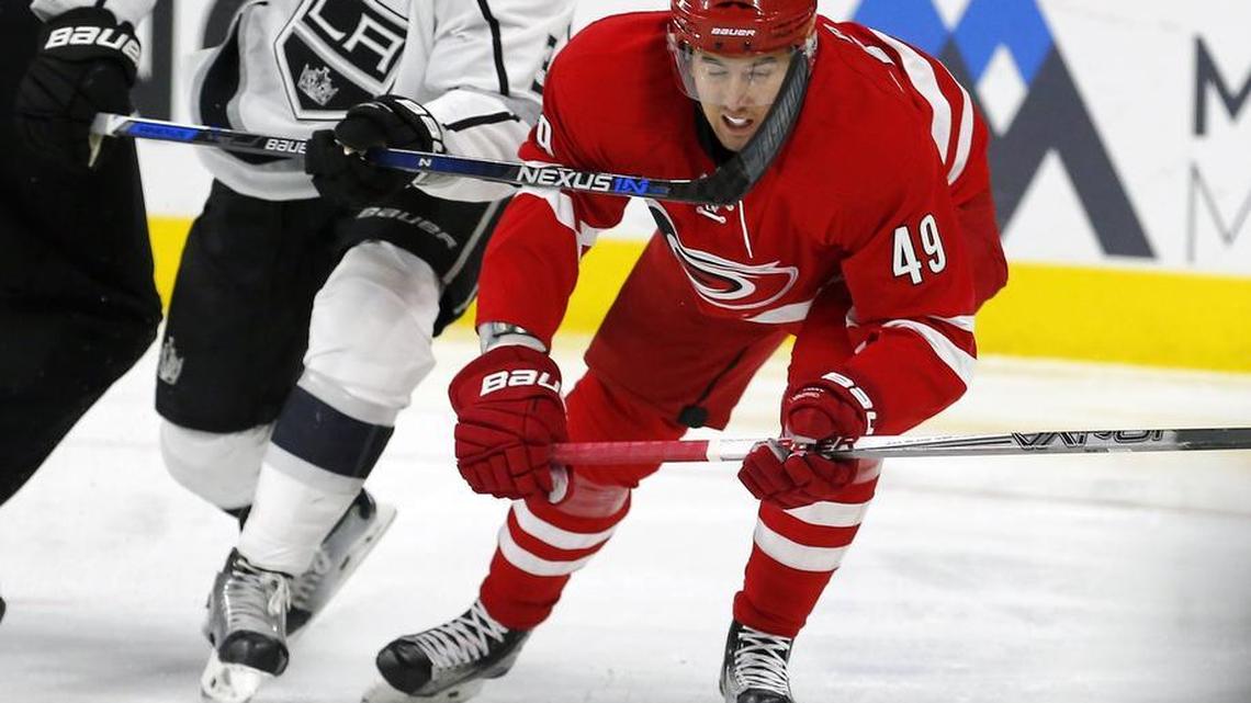 The Canes Victor Rask (49) battles the Kings Brayden McNabb (3) for the puck during an NHL game played between the Carolina Hurricanes and the Los Angeles Kings at PNC Arena in November.