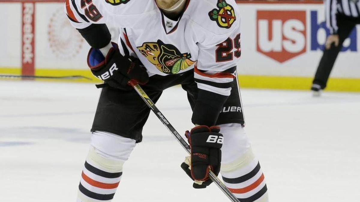 In this May 5, 2015, file photo, Chicago Blackhawks left wing Bryan Bickell (29) gets into position for a face-off during the second period of Game 3 in the second round of the NHL Stanley Cup hockey playoffs against the Minnesota Wild in St. Paul, Minn. The Carolina Hurricanes have acquired forwards Teuvo Teravainen and Bryan Bickell from the Chicago Blackhawks in exchange for two draft picks. (AP Photo/Ann Heisenfelt, File)