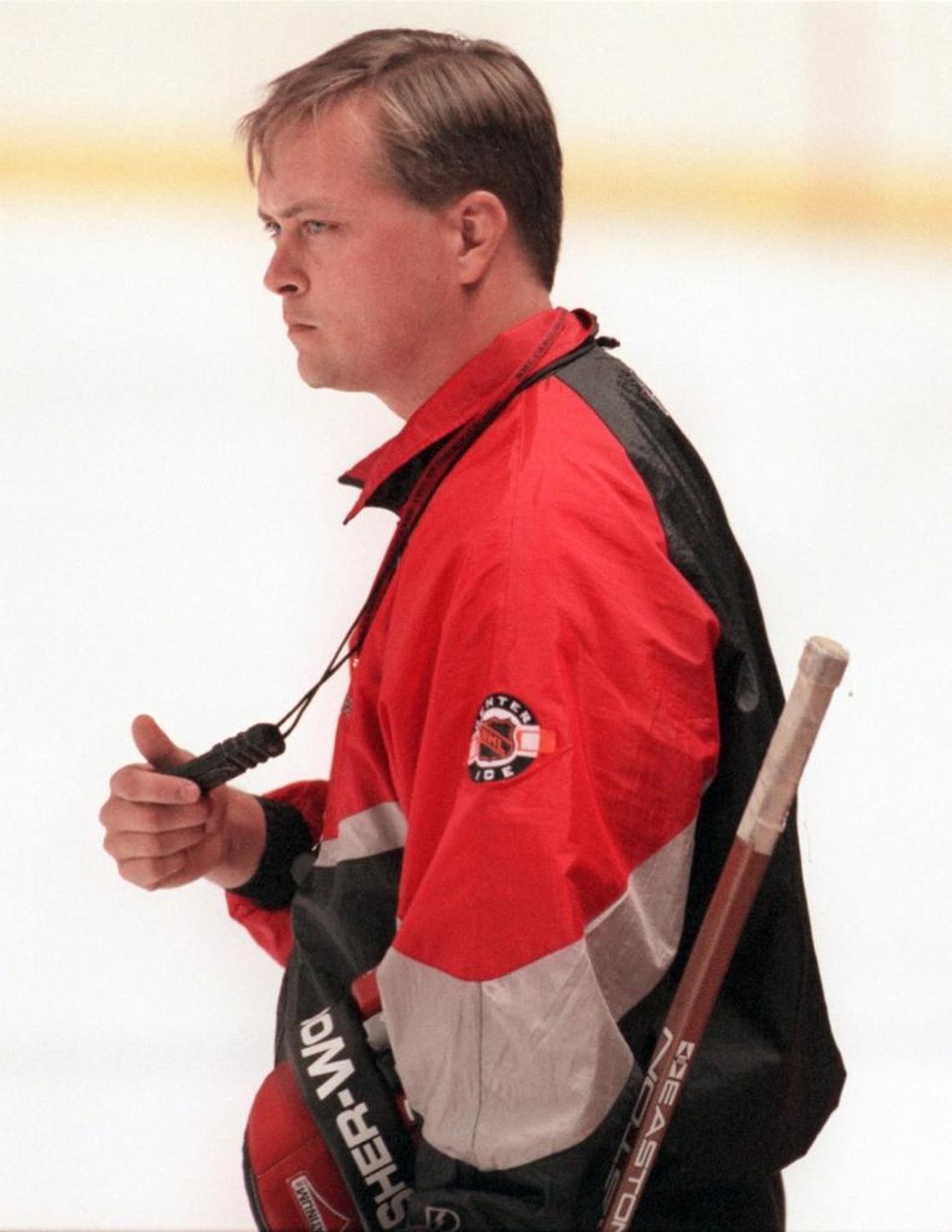 Hurricanes head coach Paul Maurice times his players as they skate the ice during the second day of training camp Sept. 11, 1997.