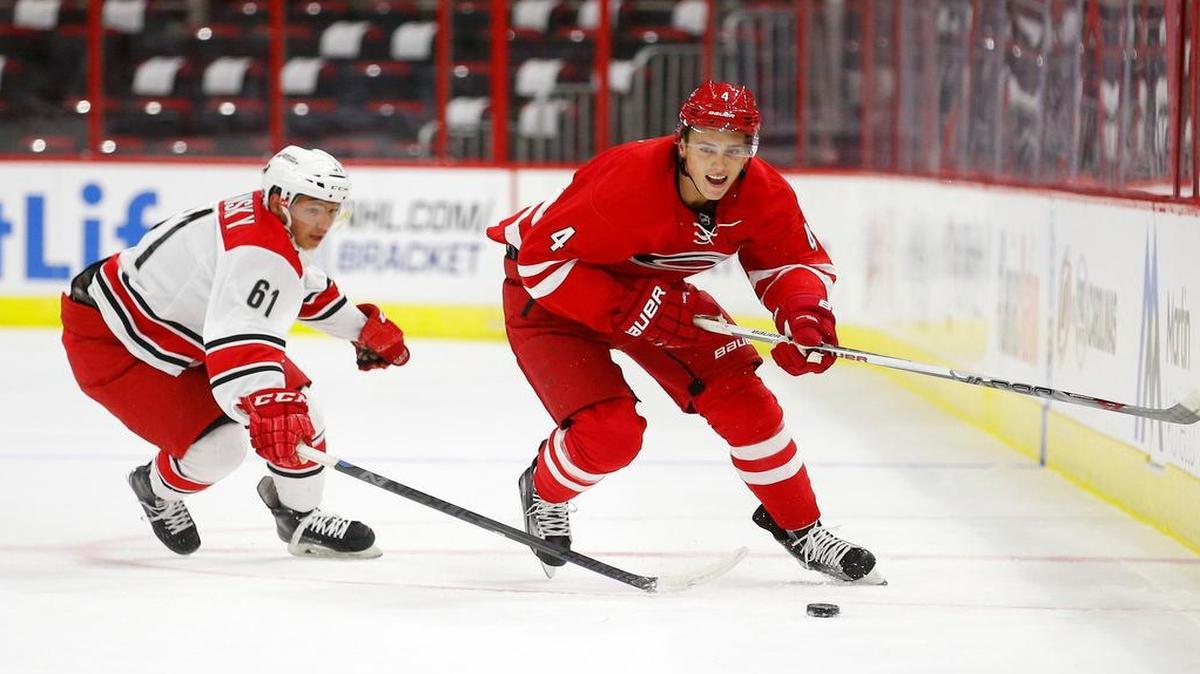 
Sergey Tolchinsky (61) challenges Haydn Fleury (4) for the puck as the Carolina Hurricanes hold a training camp for NHL prospects at PNC Arena in Raleigh on July 7, 2015.
