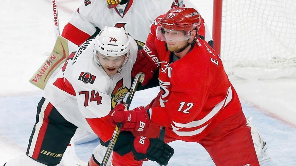 The Canes’ Eric Staal (12) jostles for position in front of the net with the Ottawa Senators' Mark Borowiecki (74) during an NHL game played between the Carolina Hurricanes and the Ottawa Senators at PNC Arena in Raleigh on Nov. 7, 2015.