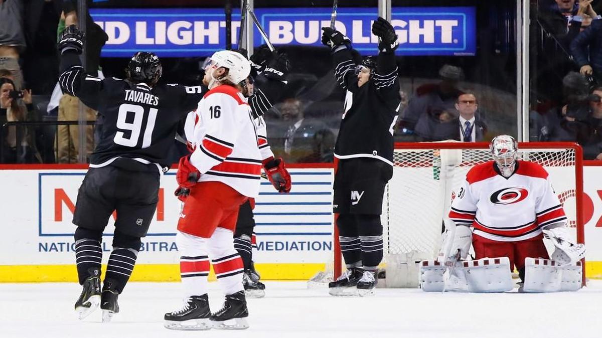 Anders Lee (27) of the New York Islanders celebrates his goal against Cam Ward (30) of the Carolina Hurricanes during their game at the Barclays Center in New York City.