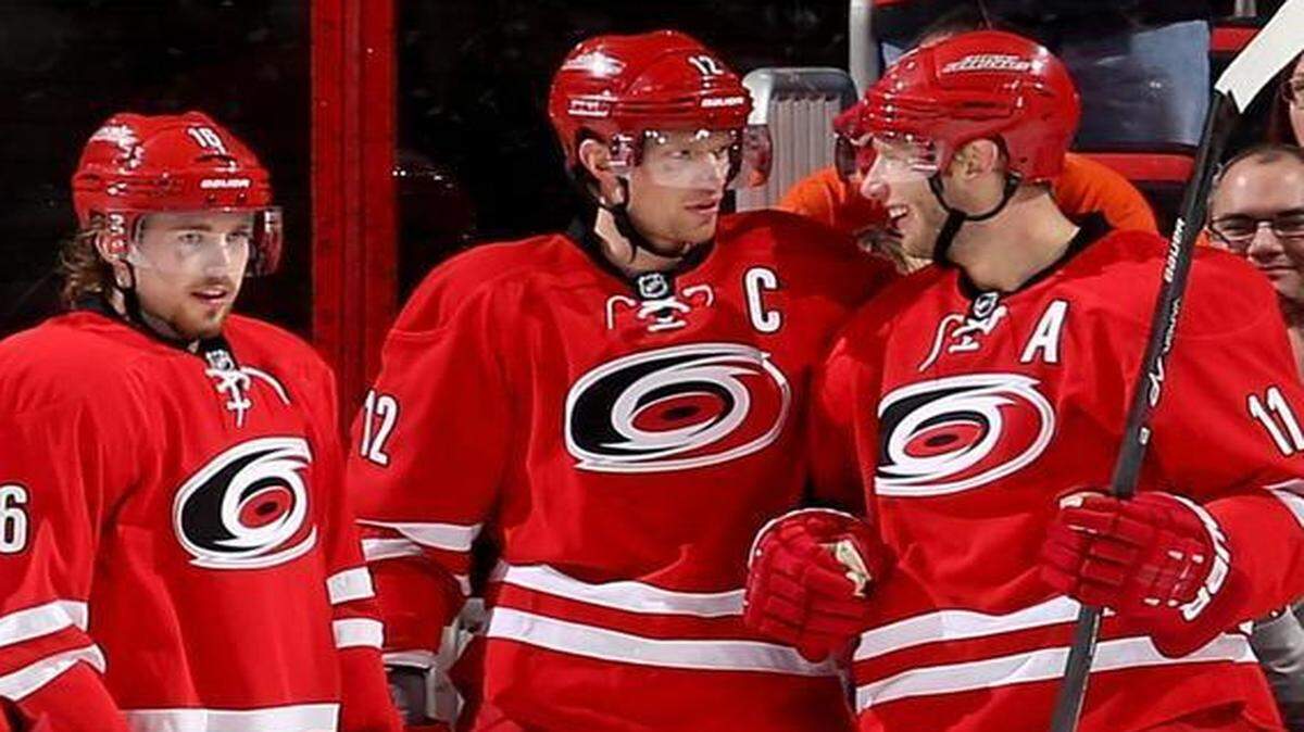 
Jordan Staal (11) of the Carolina Hurricanes celebrates his second-period goal with teammates Eric Staal (12) and Elias Lindholm 16 during their NHL game against the Philadelphia Flyers at PNC Arena in Raleigh. 
