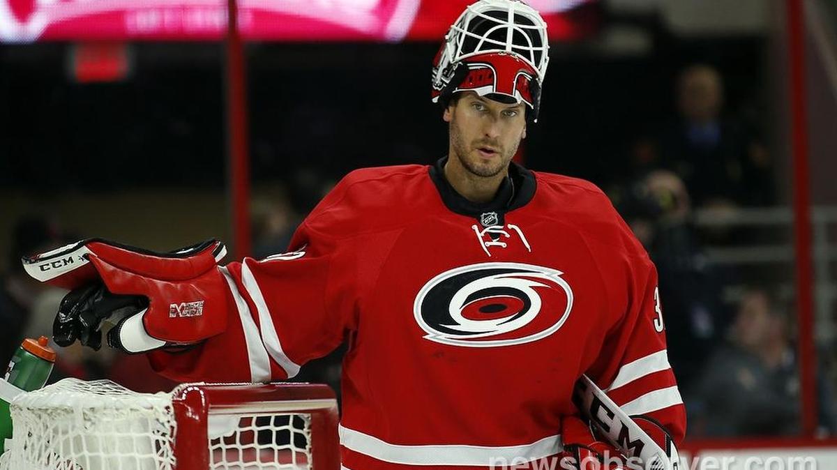 The Carolina Hurricanes' Michael Leighton (32) takes a break during the second period.