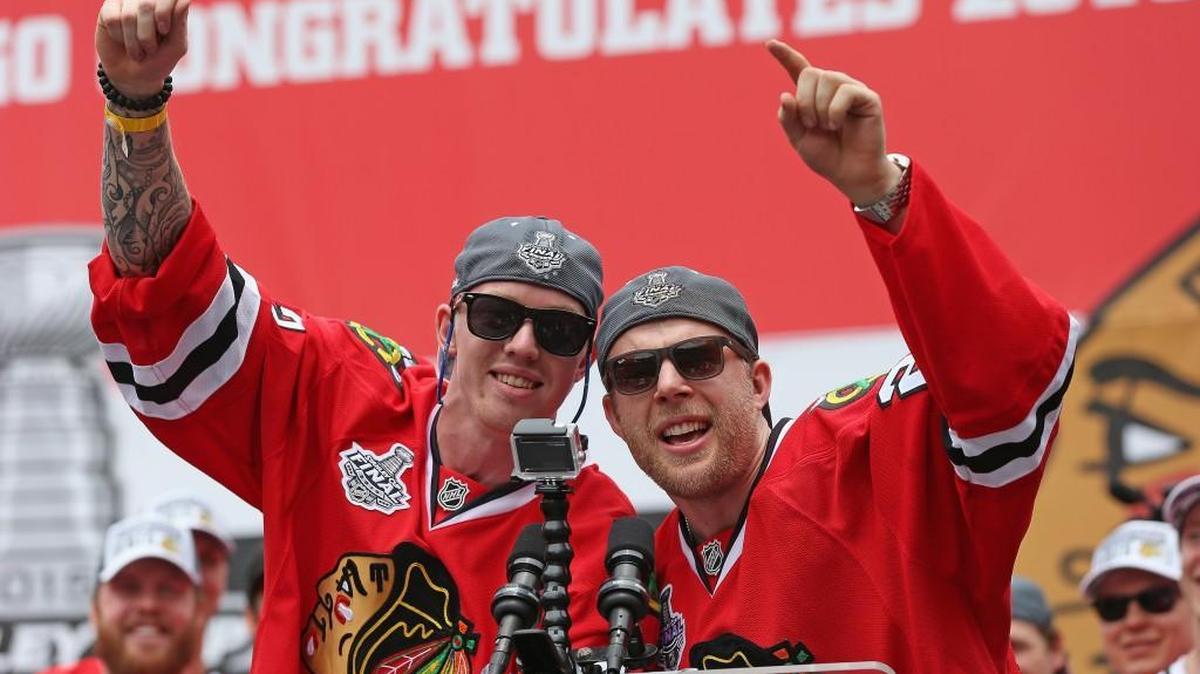 
Joakim Nordstrom #42 (left) and Kris Versteeg #23 of the Chicago Blackhawks entertain the crowd with a song during the Chicago Blackhawks Stanley Cup Championship Rally at Soldier Field on June 18, 2015 in Chicago, Illinois. 
