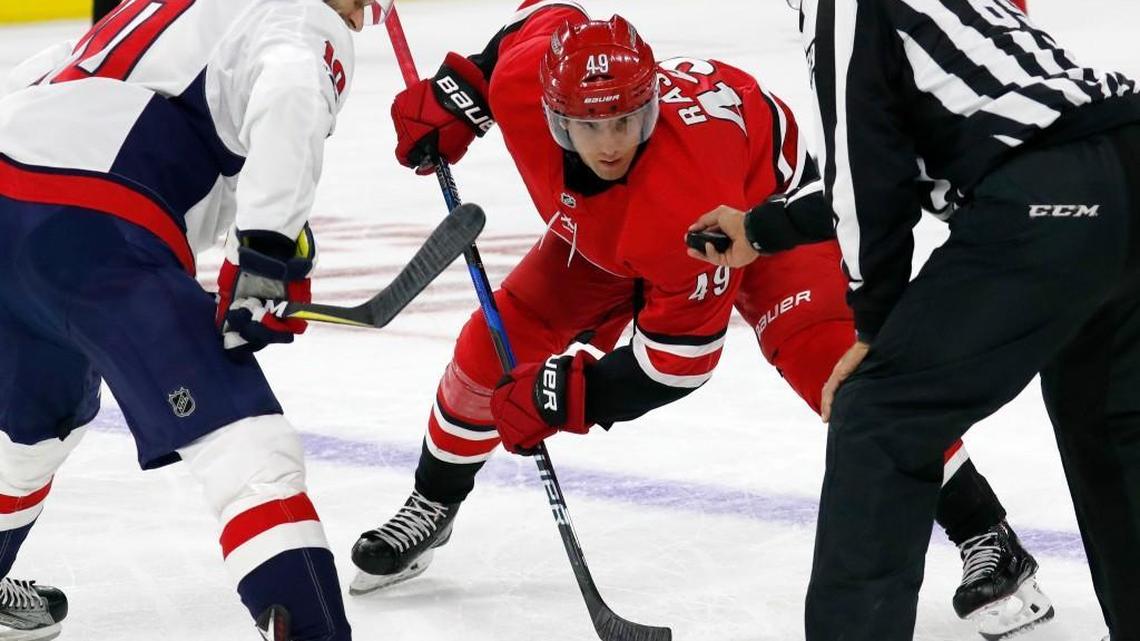 The Canes' Victor Rask (49) gets ready for a face-off against the Caps' Brett Connolly (10) during a preseason game played between the Carolina Hurricanes and the Washington Capitals at PNC Arena on Sept. 29, 2017.