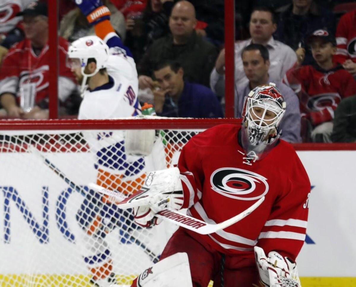 The Carolina Hurricanes' Eddie Lack (31) reacts after the New York Islanders' Andrew Ladd (16), a former Hurricane, scored a power play goal against him during game against the New York Islanders at PNC Arena on April 6, 2017.