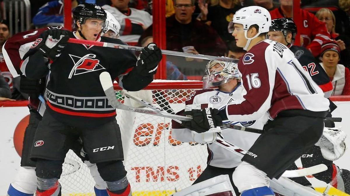 The Canes’ Victor Rask (49) scores against the Avs Semyon Varlamov (1) and Nikita Zadorov (16) during the second period at PNC Arena in Raleigh.