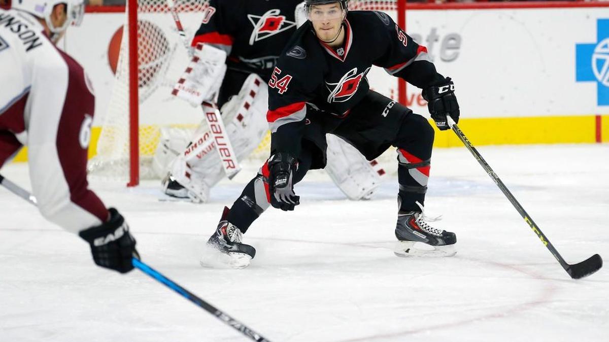 The Canes Cam Ward (30) and Brett Pesce (54) defend against the Avs Erik Johnson (6) during the first period of an NHL game played between the Carolina Hurricanes and the Colorado Avalanche at PNC Arena in Raleigh, N.C. on Oct. 30, 2015.