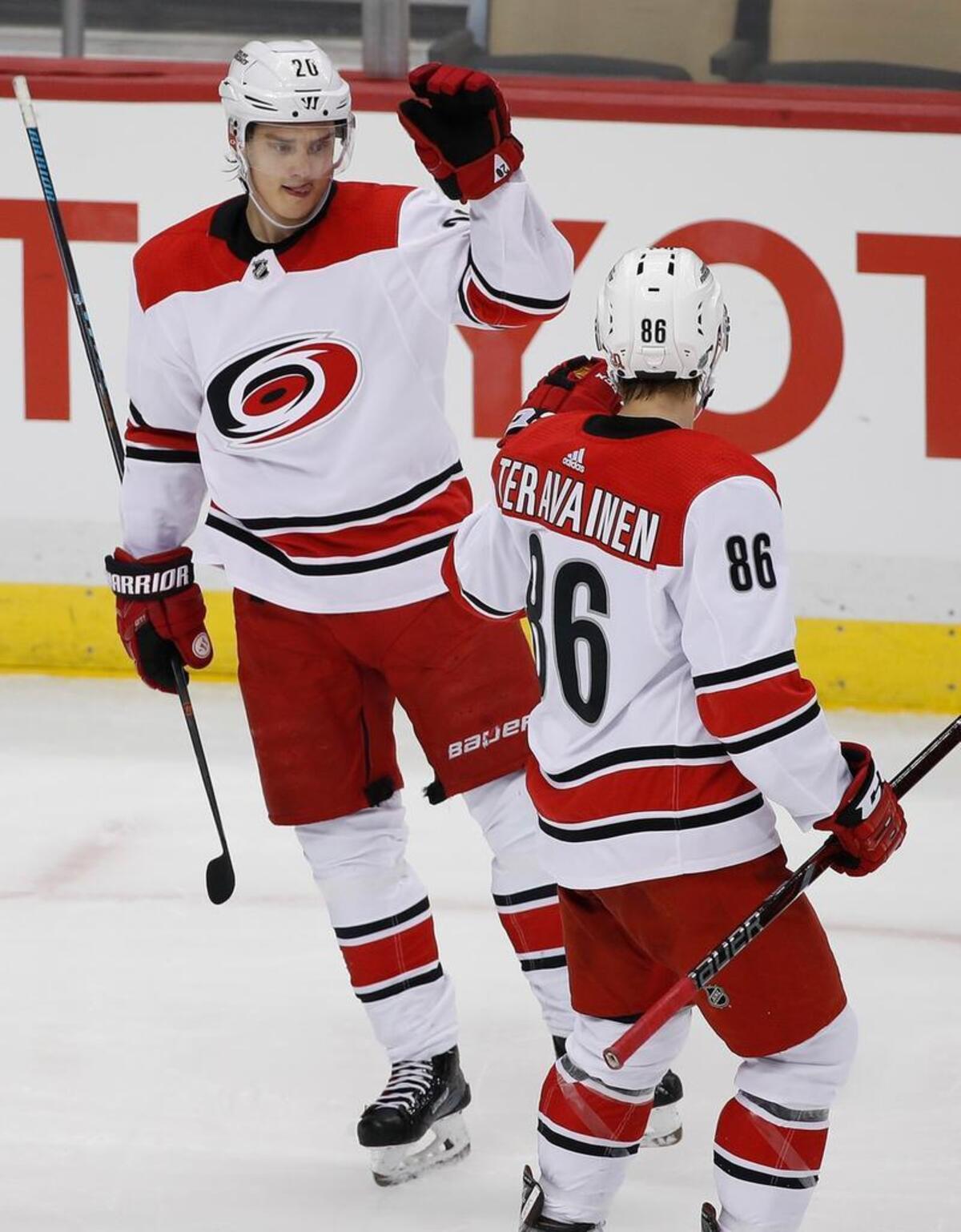 Carolina Hurricanes' Sebastian Aho (20) celebrates his goal with Teuvo Teravainen (86) during the third period against the Pittsburgh Penguins in Pittsburgh, Thursday, Jan. 4, 2018. The Hurricanes won 4-0. (AP Photo/Gene J. Puskar)